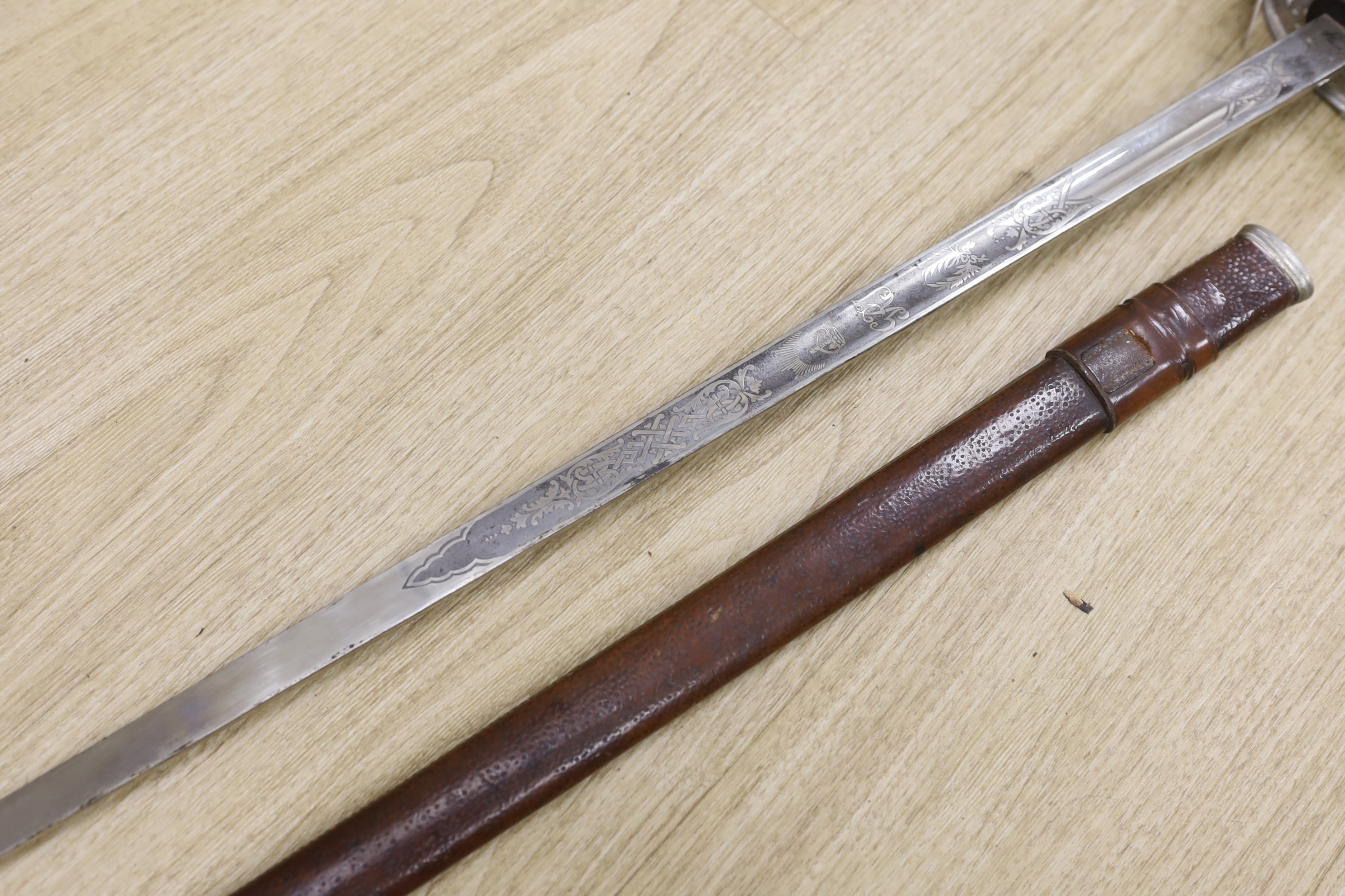 A George V officer's dress sword by Army & Navy Stores Ltd., blade 83cm, within leather scabbard